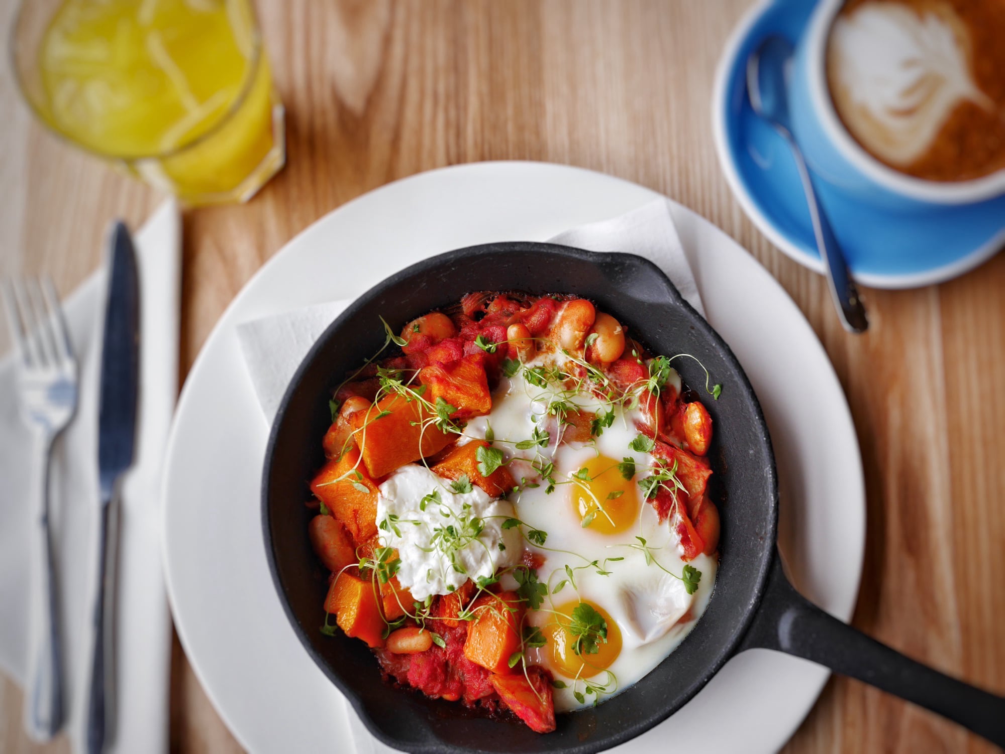 Farmhouse Skillet with Eggs, Beans, and Tomato Confit