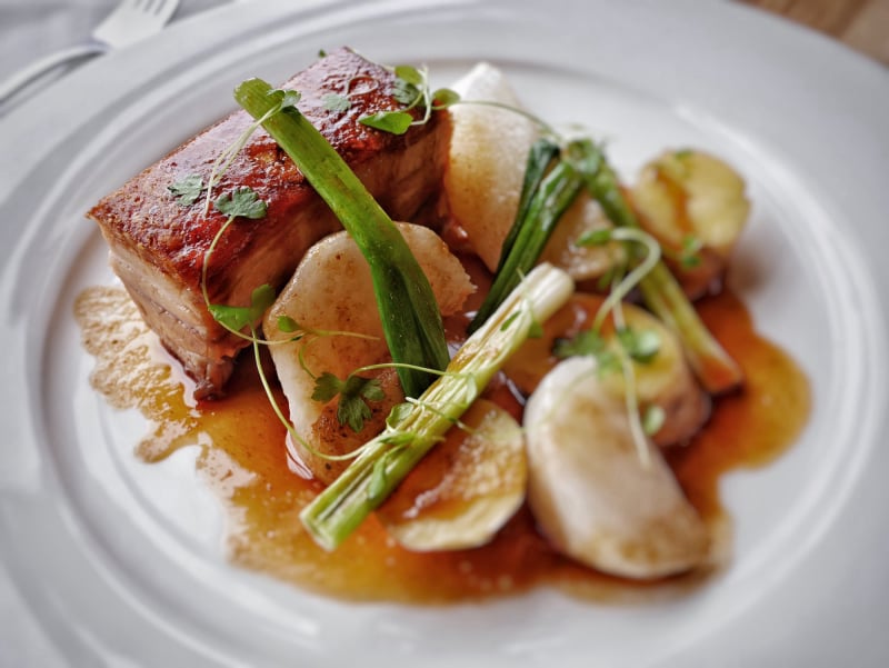 Signature Pork Belly with Aromatic Glaze and Farm Vegetables